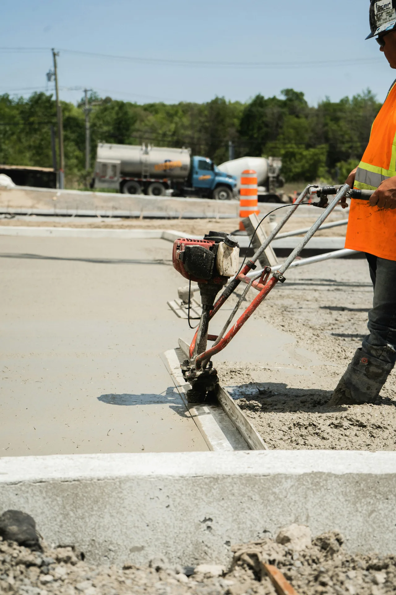 machine slipform curb and gutter being poured in Abbotsford
