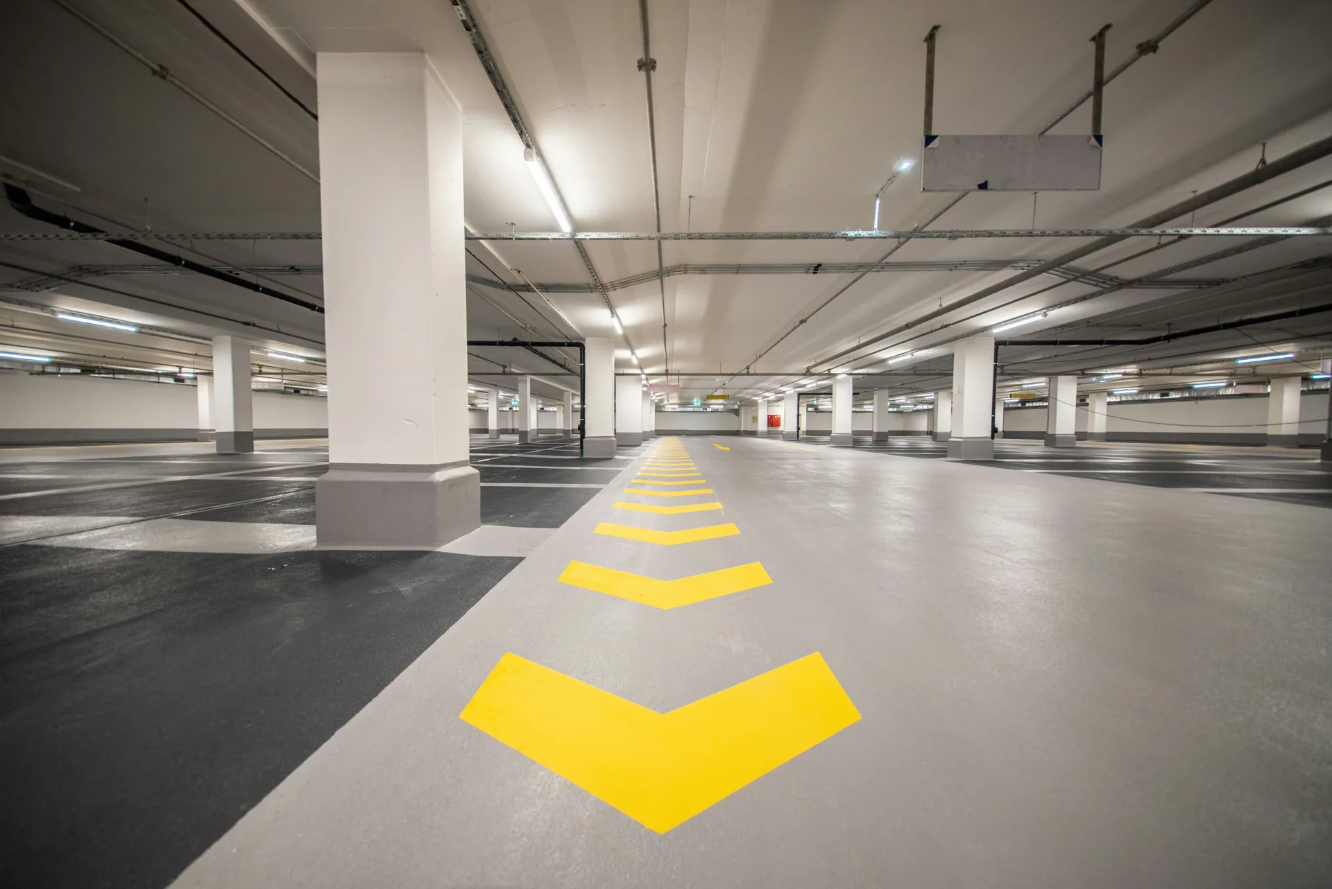 concrete parking lot with engineered drainage and catch basin
