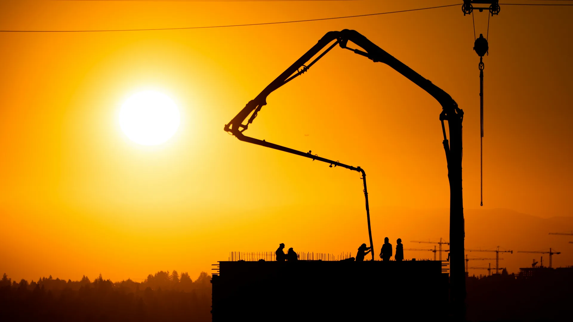concrete boom pump on a Abbotsford construction site at sunset