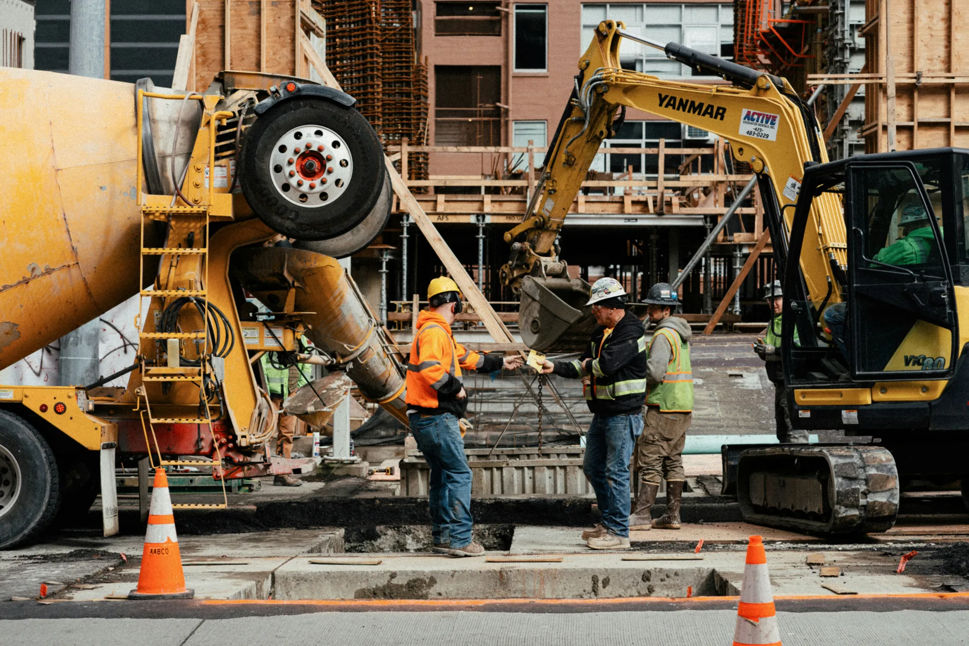 ready mix concrete pour on a Abbotsford urban site with a mini excavator