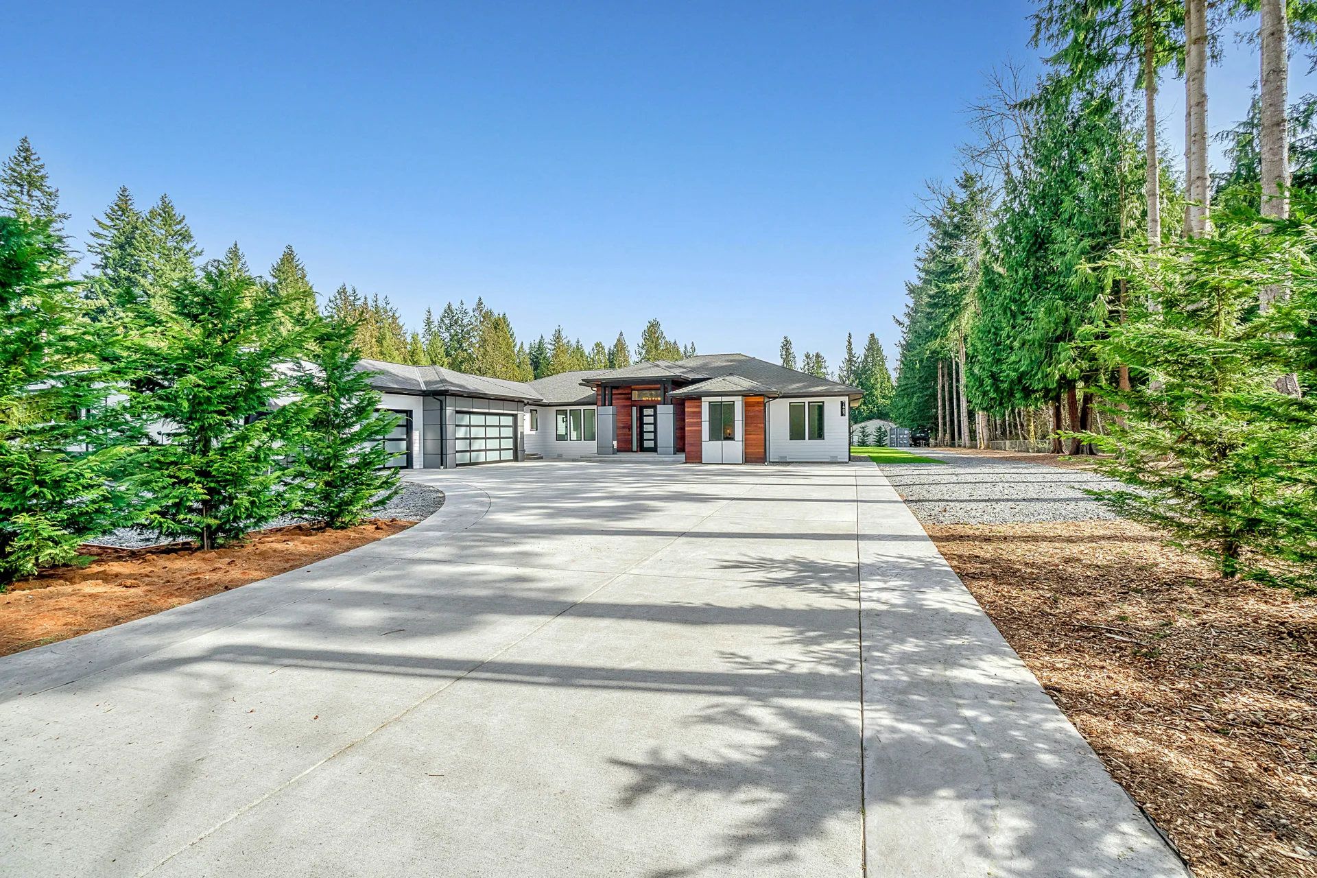 long coloured concrete driveway at a Abbotsford home