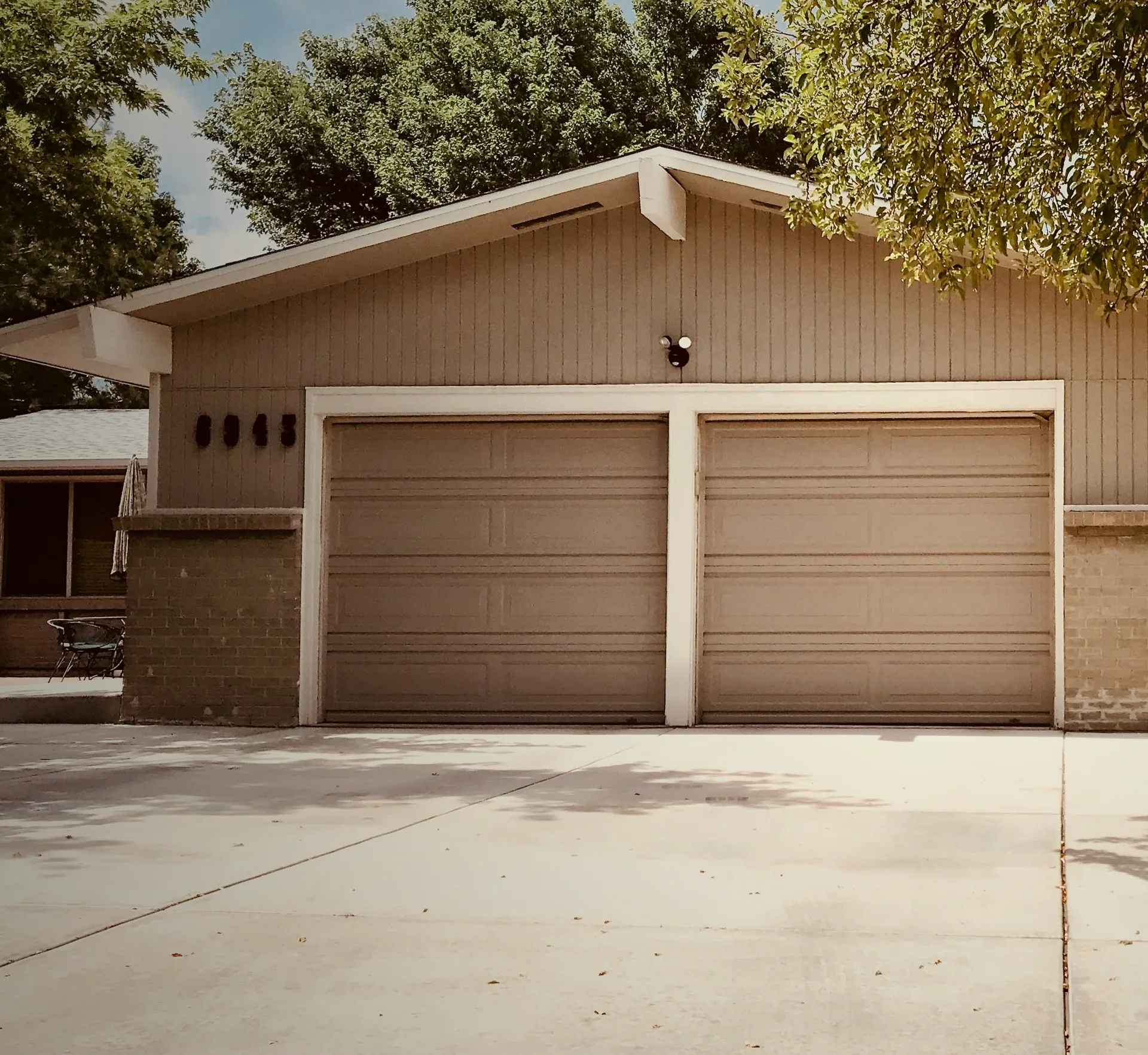 concrete driveway at a ranch home with a double garage in Abbotsford