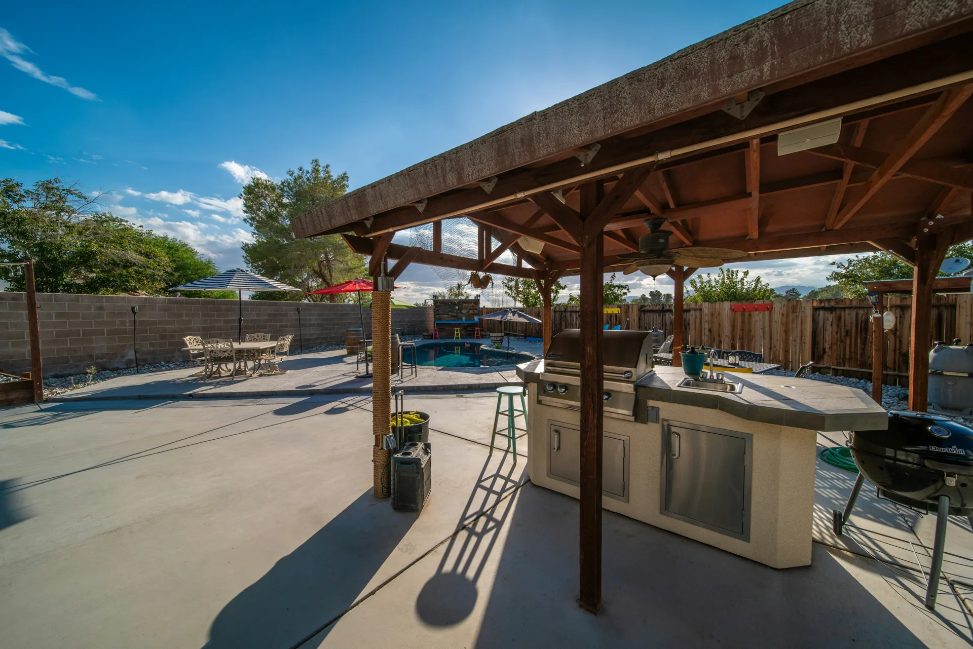 broom-finish concrete pad around a fire pit at a Abbotsford home