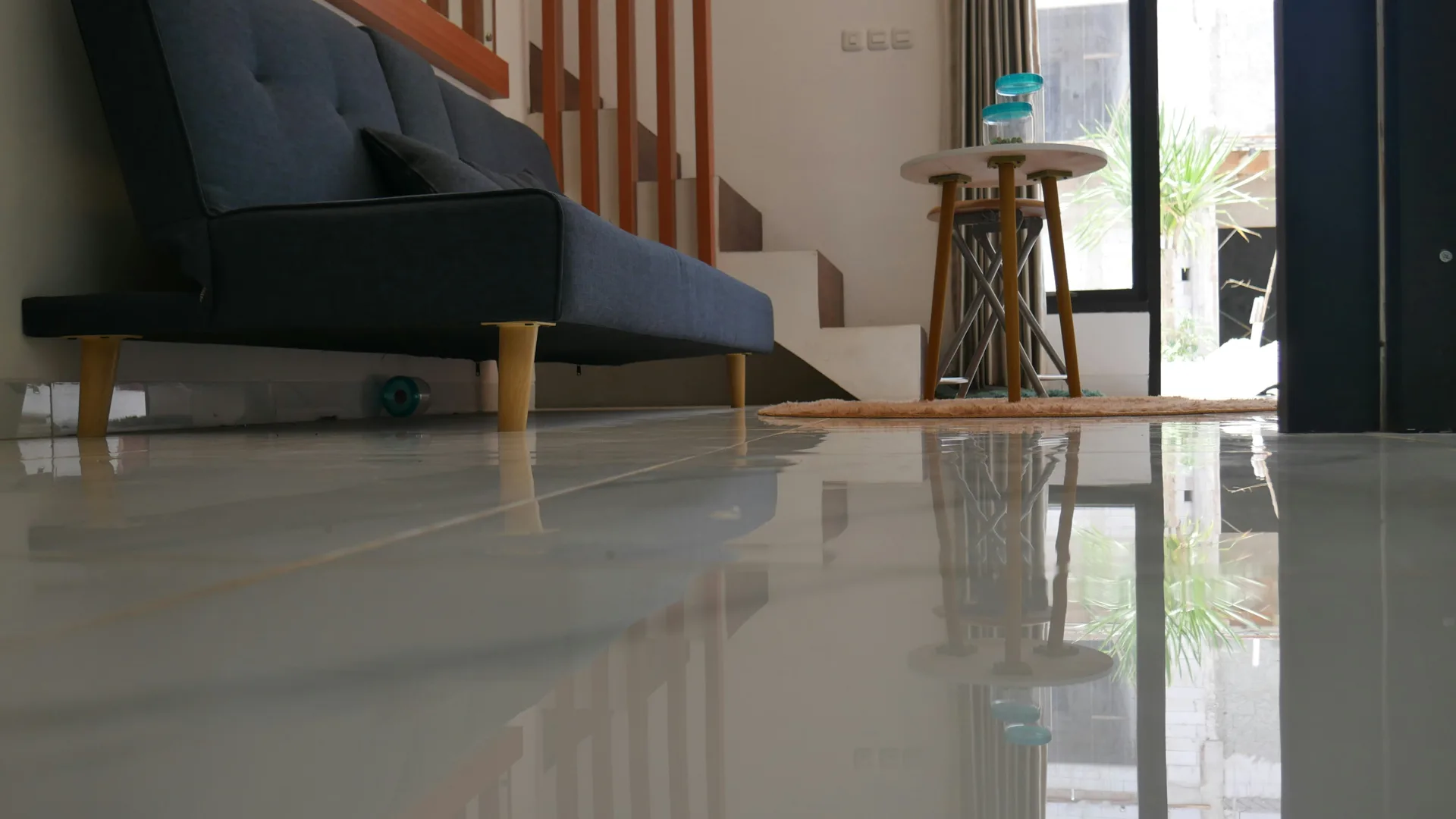 polished concrete floor reflecting light in a Abbotsford living room